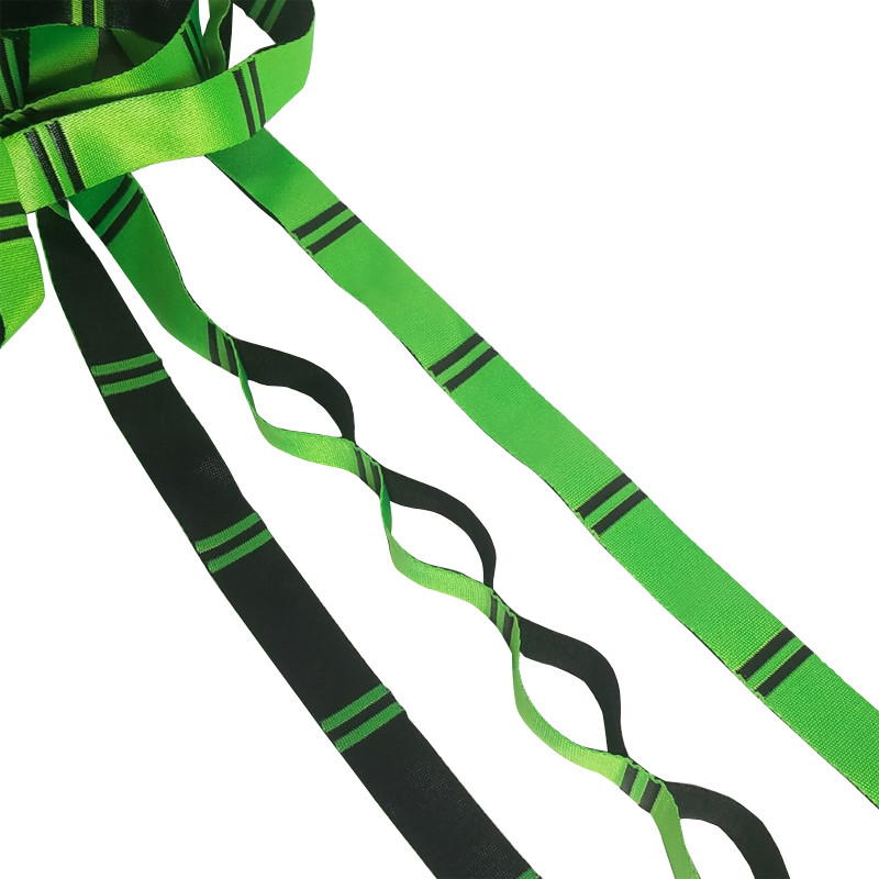 Closeup of three green and black daisy chain straps.