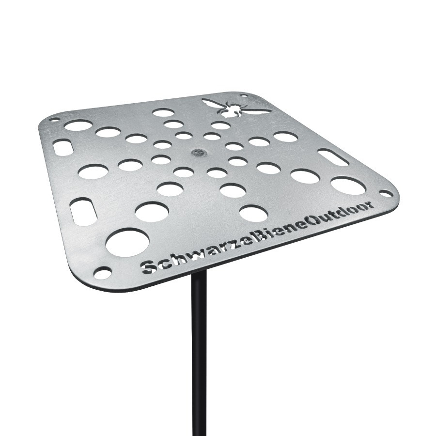 Angled top view of the Schwarze Biene Outdoor Table, and aluminum camp table with utensil-holding holes.