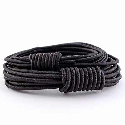 A coiled roll of black hammock shock cord cable.